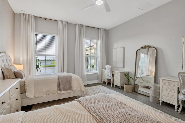 8209 Redonda Loop, Lakewood Ranch, FL 34202 - bedroom featuring multiple windows, wood finished floors, and a ceiling fan