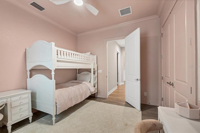 8209 Redonda Loop, Lakewood Ranch, FL 34202 - bedroom with wood finished floors, ornamental molding, and a ceiling fan