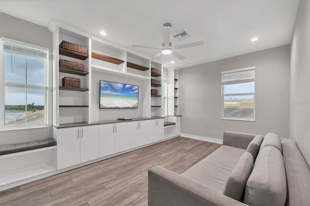 8209 Redonda Loop, Lakewood Ranch, FL 34202 - living area with light wood finished floors, a ceiling fan, and recessed lighting