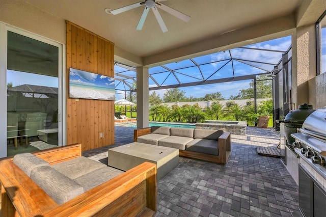 8209 Redonda Loop, Lakewood Ranch, FL 34202 - view of patio / terrace with outdoor lounge area, a ceiling fan, a jacuzzi, an outdoor kitchen, and glass enclosure