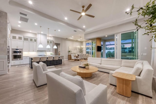8209 Redonda Loop, Lakewood Ranch, FL 34202 - living area with light wood-style floors, a ceiling fan, and recessed lighting