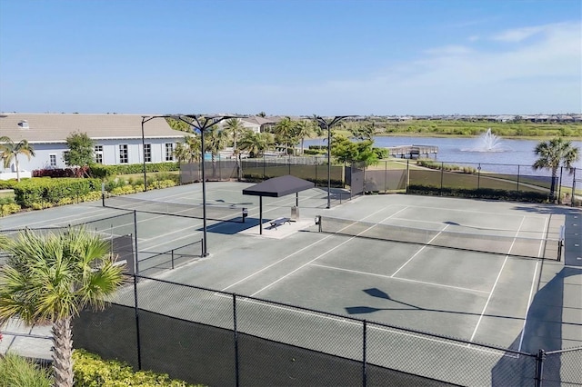 8209 Redonda Loop, Lakewood Ranch, FL 34202 - view of tennis court featuring a water view
