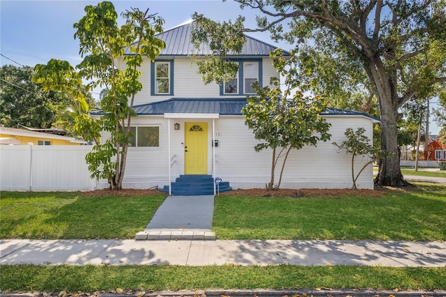 719 22nd St W, Bradenton, FL 34205 - view of front facade with entry steps, a metal roof, and a standing seam roof