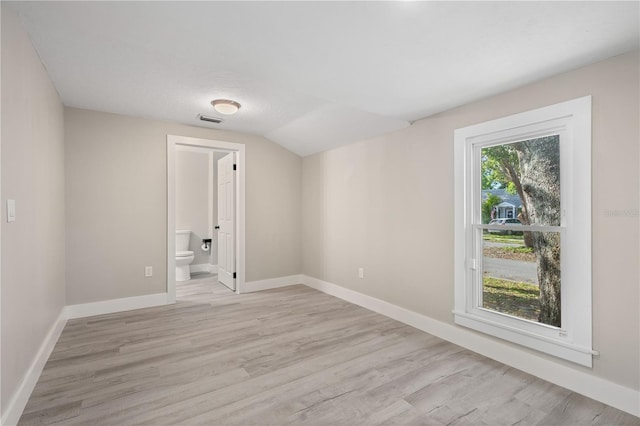 719 22nd St W, Bradenton, FL 34205 - unfurnished room featuring light wood-style floors and lofted ceiling