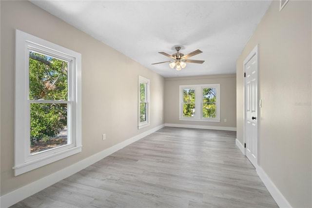 719 22nd St W, Bradenton, FL 34205 - spare room featuring healthy amount of natural light, a ceiling fan, and wood finished floors