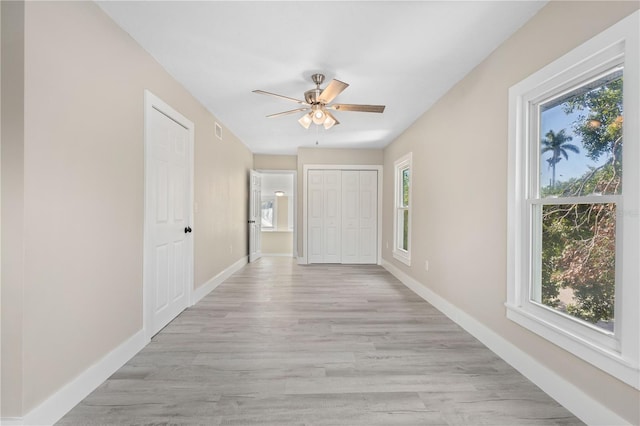719 22nd St W, Bradenton, FL 34205 - hall with plenty of natural light and light wood finished floors