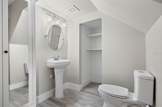 719 22nd St W, Bradenton, FL 34205 - half bath with wood finished floors and vaulted ceiling