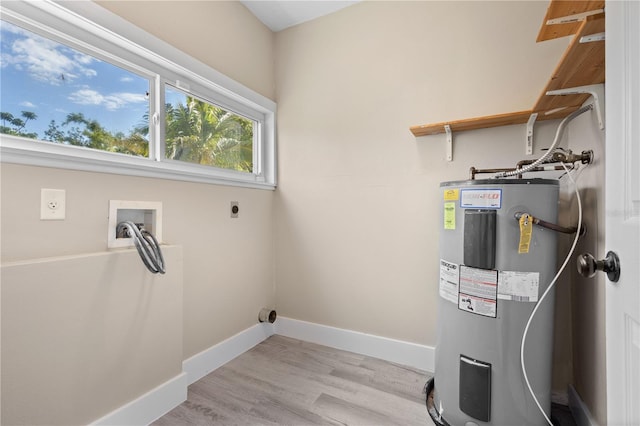 719 22nd St W, Bradenton, FL 34205 - laundry room with water heater, electric dryer hookup, hookup for a washing machine, and light wood-style floors
