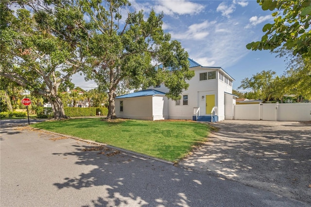 719 22nd St W, Bradenton, FL 34205 - view of front of home featuring a gate and driveway