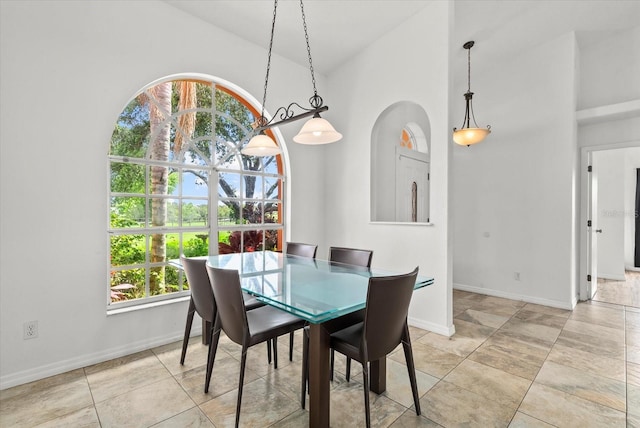 6805 225th St E, Bradenton, FL 34211 - dining space featuring high vaulted ceiling and baseboards