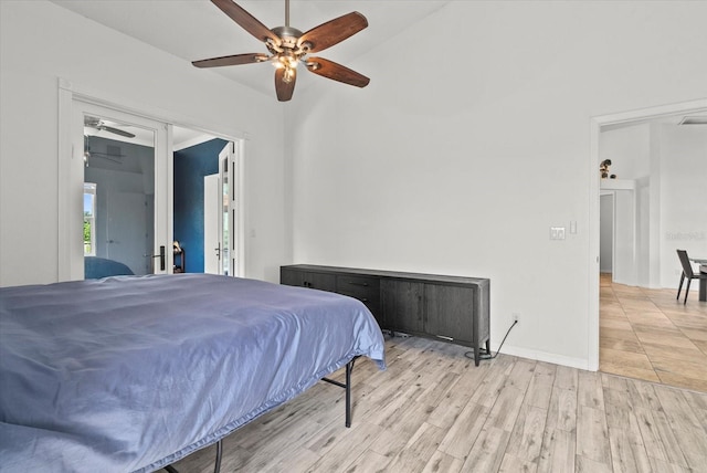 6805 225th St E, Bradenton, FL 34211 - bedroom with french doors, light wood-style floors, ceiling fan, and access to exterior