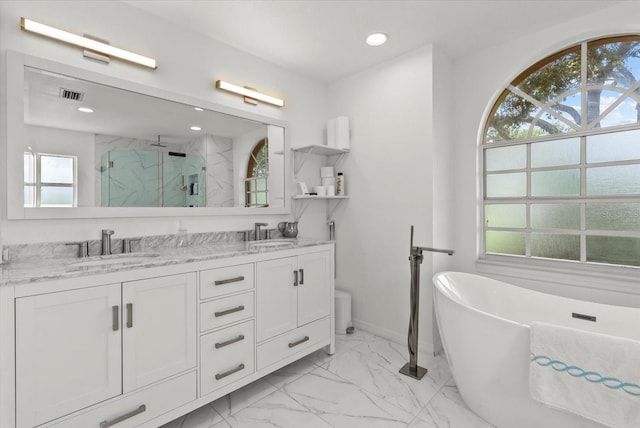 6805 225th St E, Bradenton, FL 34211 - full bath featuring a marble finish shower, marble finish floors, a freestanding bath, double vanity, and recessed lighting