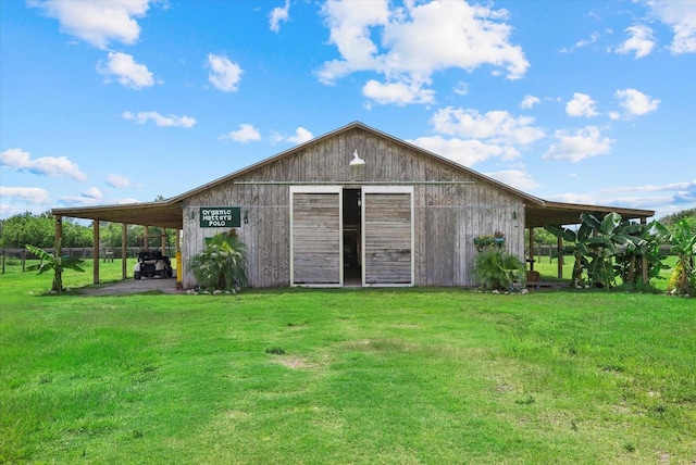 6805 225th St E, Bradenton, FL 34211 - view of pole building featuring a yard and a carport