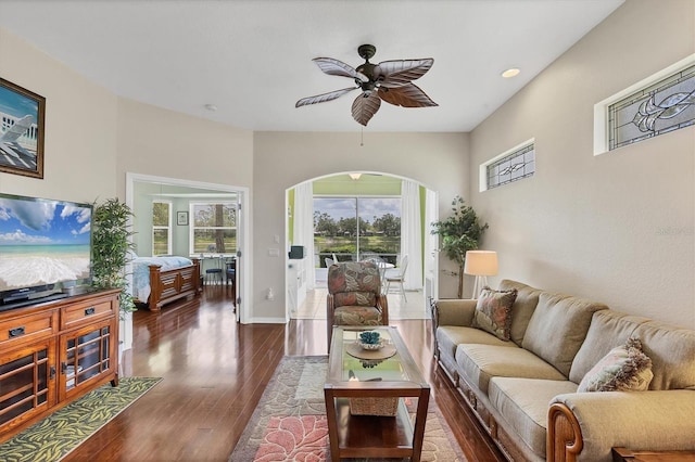 2025 Lynx Run, North Port, FL 34288 - living room with arched walkways, dark wood-style flooring, a ceiling fan, and recessed lighting