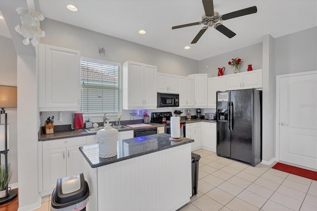 2025 Lynx Run, North Port, FL 34288 - kitchen featuring black appliances, white cabinetry, a ceiling fan, a center island, and light tile patterned floors