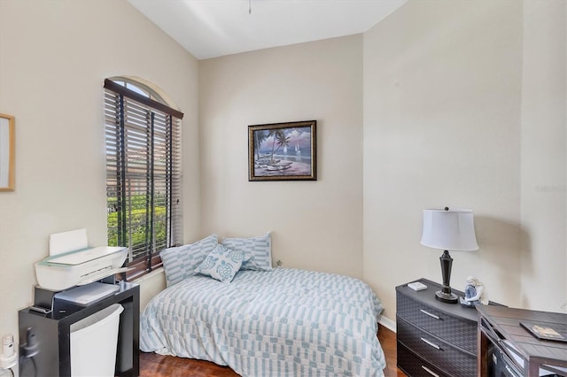 2025 Lynx Run, North Port, FL 34288 - bedroom featuring multiple windows and dark wood-type flooring