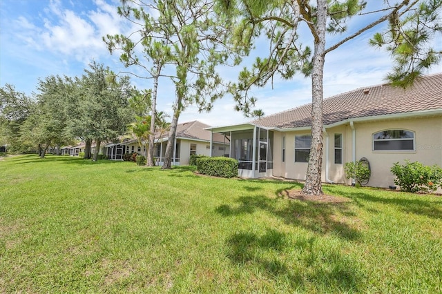 2025 Lynx Run, North Port, FL 34288 - view of green lawn featuring a sunroom