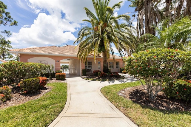 2025 Lynx Run, North Port, FL 34288 - view of front facade with a tile roof and stucco siding