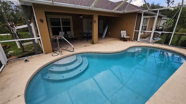 17215 Berwin Ave, Port Charlotte, FL 33948 - outdoor pool featuring glass enclosure, a patio, and a ceiling fan