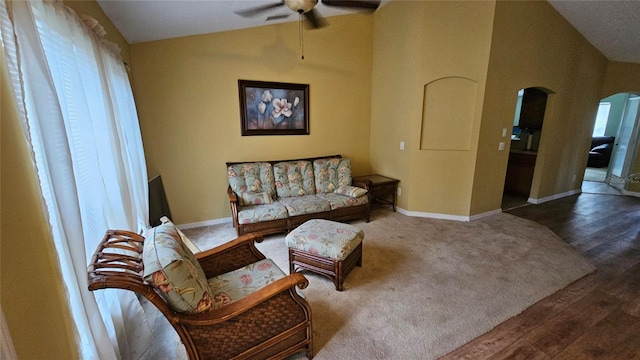 17215 Berwin Ave, Port Charlotte, FL 33948 - living area featuring lofted ceiling, arched walkways, ceiling fan, and wood finished floors