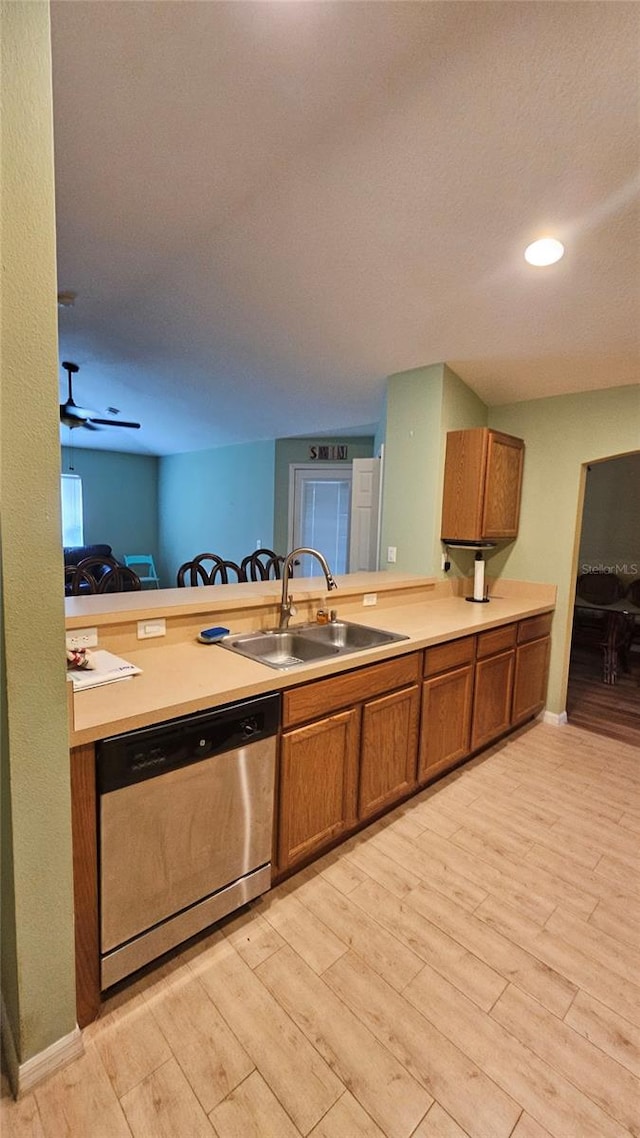 17215 Berwin Ave, Port Charlotte, FL 33948 - kitchen featuring dishwasher, brown cabinetry, light wood-type flooring, light countertops, and recessed lighting