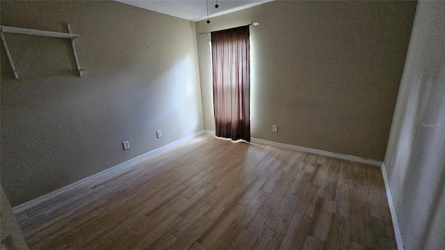 17215 Berwin Ave, Port Charlotte, FL 33948 - empty room with wood finished floors and baseboards