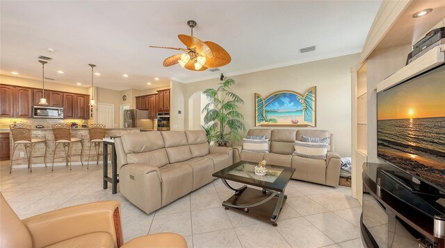 7915 Kavanagh Ct, Sarasota, FL 34240 - living area featuring a ceiling fan, recessed lighting, light tile patterned floors, and ornamental molding