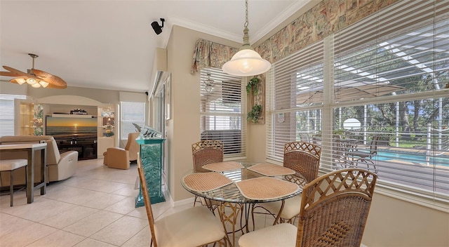 7915 Kavanagh Ct, Sarasota, FL 34240 - dining room with ceiling fan, light tile patterned floors, and ornamental molding