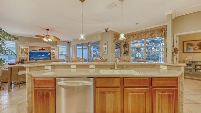 7915 Kavanagh Ct, Sarasota, FL 34240 - kitchen featuring dishwasher, light tile patterned floors, open floor plan, healthy amount of natural light, and ornamental molding