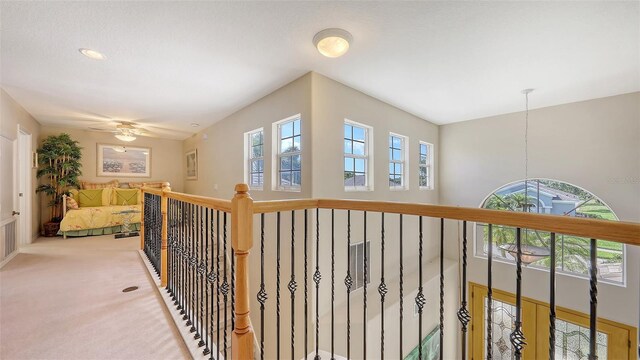 7915 Kavanagh Ct, Sarasota, FL 34240 - hall with light carpet and a chandelier