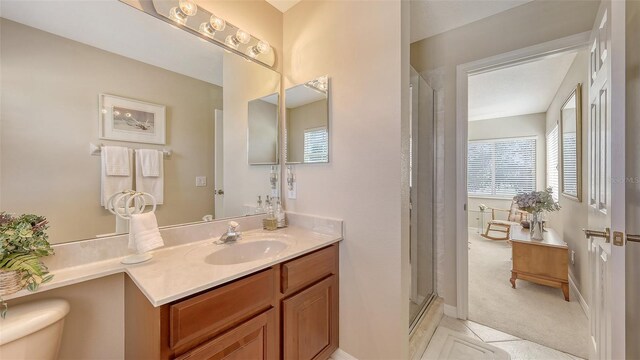 7915 Kavanagh Ct, Sarasota, FL 34240 - bathroom with vanity, a stall shower, and tile patterned floors