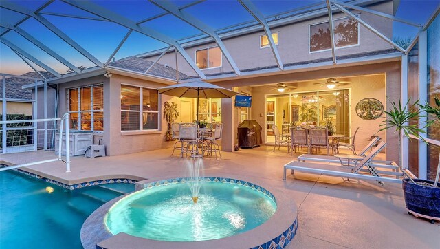 7915 Kavanagh Ct, Sarasota, FL 34240 - view of pool with a patio area, a pool with connected hot tub, a lanai, and outdoor dining area