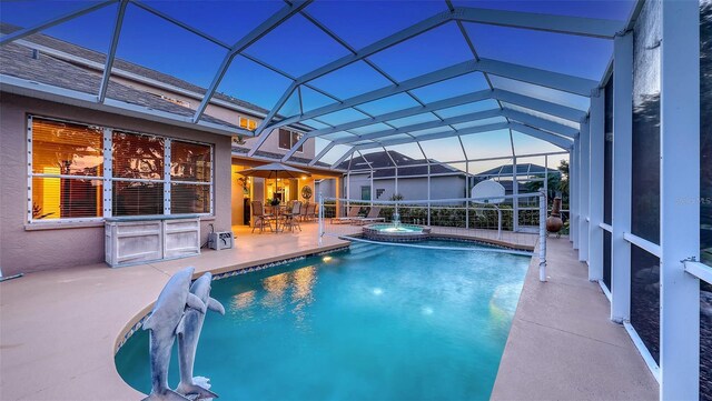 7915 Kavanagh Ct, Sarasota, FL 34240 - view of pool with a patio, a pool with connected hot tub, and glass enclosure