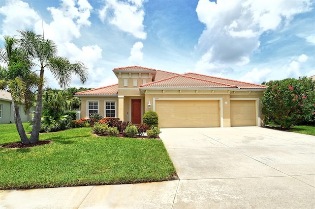 6214 45th Ln E, Bradenton, FL 34203 - mediterranean / spanish-style home featuring concrete driveway, an attached garage, a front lawn, and stucco siding