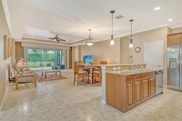 6214 45th Ln E, Bradenton, FL 34203 - kitchen featuring stainless steel appliances, ornamental molding, light stone countertops, light tile patterned floors, and brown cabinets