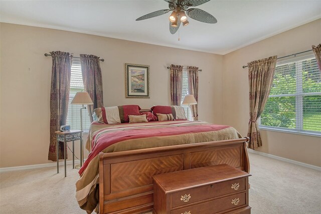 6214 45th Ln E, Bradenton, FL 34203 - bedroom with light colored carpet and ceiling fan
