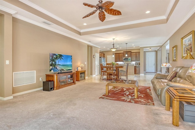 6214 45th Ln E, Bradenton, FL 34203 - living area featuring ornamental molding, a tray ceiling, recessed lighting, light carpet, and a ceiling fan