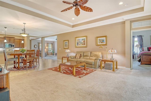 6214 45th Ln E, Bradenton, FL 34203 - living area with a ceiling fan, crown molding, a raised ceiling, recessed lighting, and light carpet