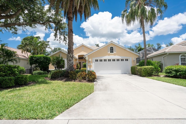 4374 Mirabella Cir, Bradenton, FL 34210 - view of front facade with a front lawn, concrete driveway, stucco siding, and an attached garage