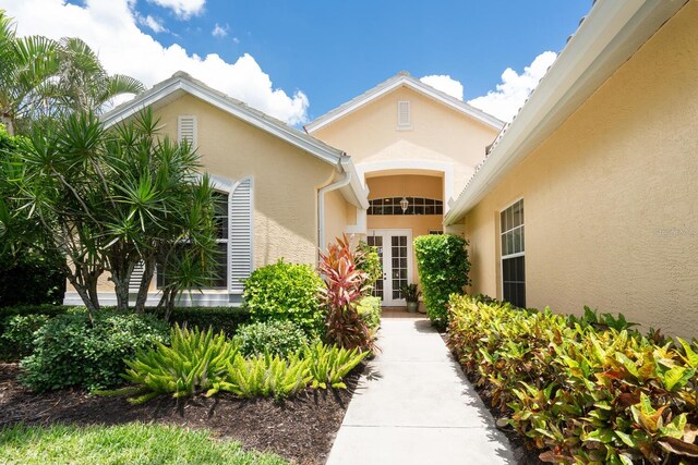 4374 Mirabella Cir, Bradenton, FL 34210 - doorway to property featuring stucco siding