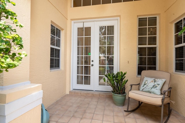 4374 Mirabella Cir, Bradenton, FL 34210 - view of exterior entry featuring french doors, stucco siding, and a patio