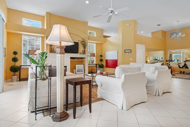 4374 Mirabella Cir, Bradenton, FL 34210 - living area featuring a towering ceiling, a ceiling fan, a chandelier, recessed lighting, and light tile patterned flooring