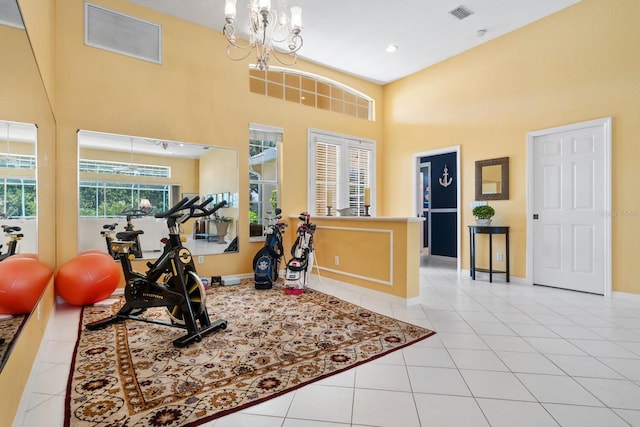 4374 Mirabella Cir, Bradenton, FL 34210 - exercise room with a high ceiling, tile patterned floors, a chandelier, and recessed lighting