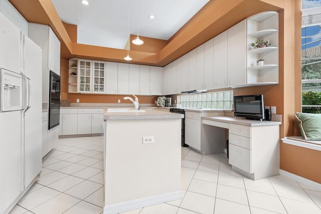 4374 Mirabella Cir, Bradenton, FL 34210 - kitchen featuring open shelves, black appliances, an island with sink, light countertops, and recessed lighting
