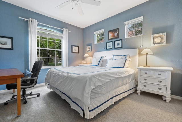 4374 Mirabella Cir, Bradenton, FL 34210 - carpeted bedroom with a desk and a ceiling fan