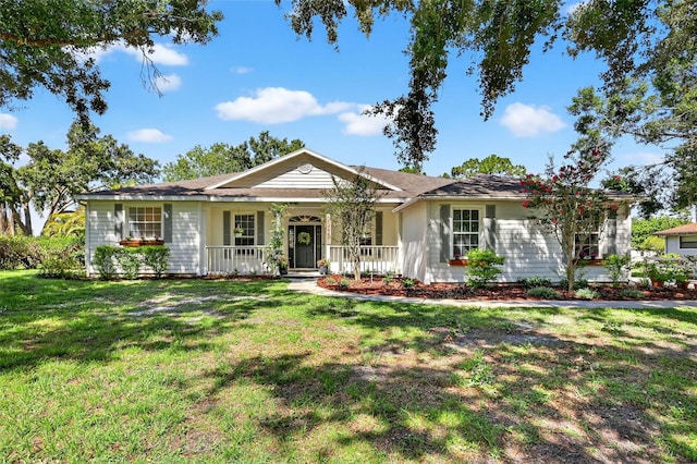 13640 2nd Ave E, Bradenton, FL 34212 - ranch-style house with covered porch and a front lawn