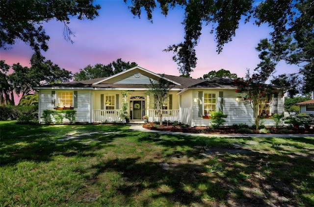 13640 2nd Ave E, Bradenton, FL 34212 - single story home featuring a porch and a lawn