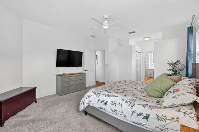 13640 2nd Ave E, Bradenton, FL 34212 - carpeted bedroom with ceiling fan and ensuite bathroom