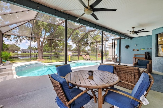 13640 2nd Ave E, Bradenton, FL 34212 - outdoor pool featuring ceiling fan, a patio area, and glass enclosure