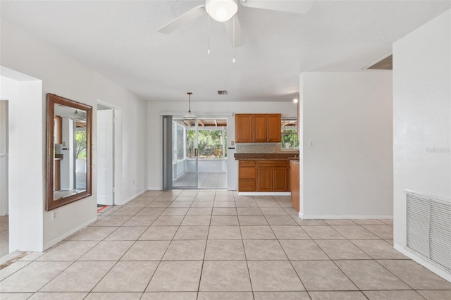 1404 Dartmouth Dr, Bradenton, FL 34207 - empty room with a ceiling fan and light tile patterned floors